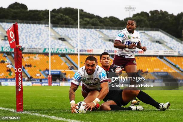 Dylan Walker of the Sea Eagles dives over to score a try during the round 25 NRL match between the New Zealand Warriors and the Manly Sea Eagles at...