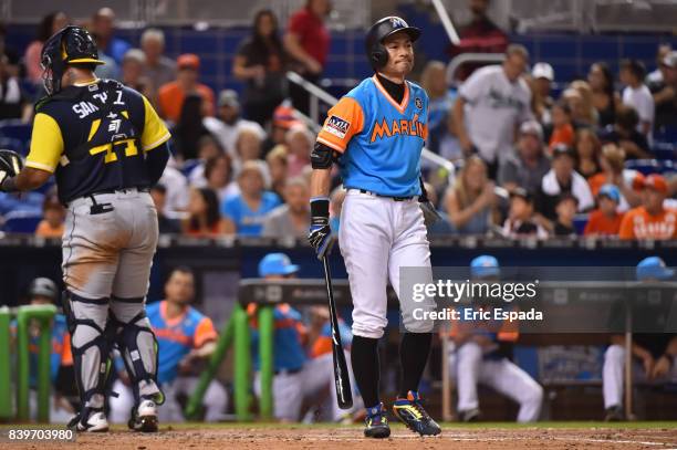 Ichiro Suzuki of the Miami Marlins reacts after fouling a pitch off during the seventh inning against the San Diego Padres at Marlins Park on August...