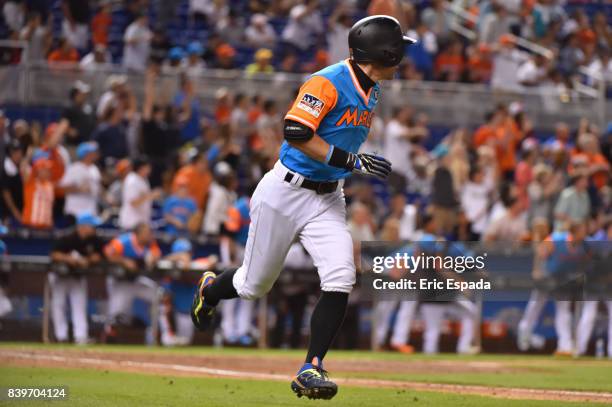 Ichiro Suzuki of the Miami Marlins singles during the seventh inning against the San Diego Padres at Marlins Park on August 26, 2017 in Miami,...