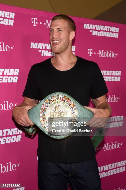 Player Mason Plumlee poses with the WBC Money Belt on T-Mobile's magenta carpet duirng the Showtime, WME IME and Mayweather Promotions VIP Pre-Fight...