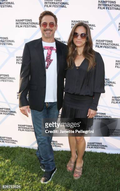 Robert Downey Jr. And Susan Downey attend the Hamptons International Film Festival SummerDocs Series Screening of ICARUS on August 26, 2017 in East...