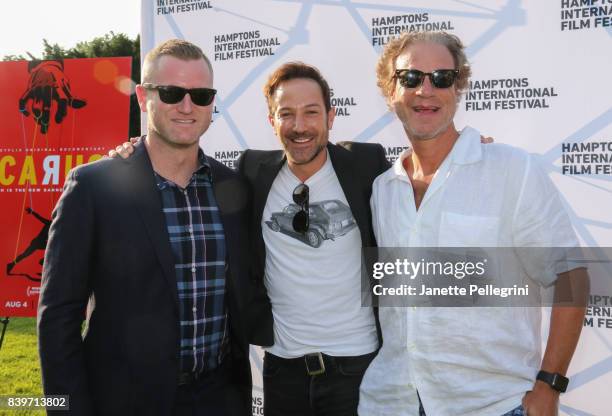 Jon Bertain, Bryan Fogel and David Fialkow attend the Hamptons International Film Festival SummerDocs Series Screening of ICARUS on August 26, 2017...