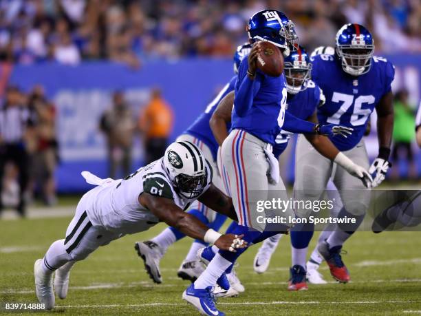 New York Jets defensive end Sheldon Richardson applies pressure on New York Giants quarterback Josh Johnson during the National Football League...