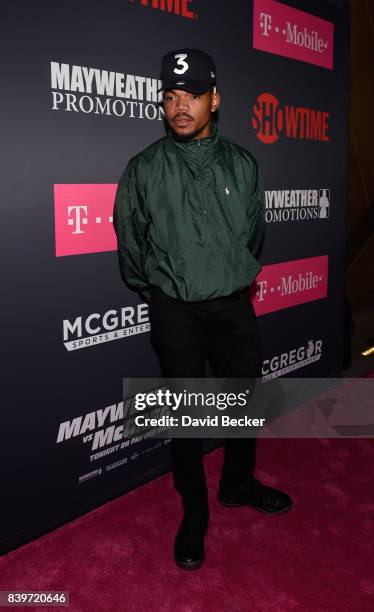 Recording artist Chance The Rapper arrives on T-Mobile's magenta carpet duirng the Showtime, WME IME and Mayweather Promotions VIP Pre-Fight Party...