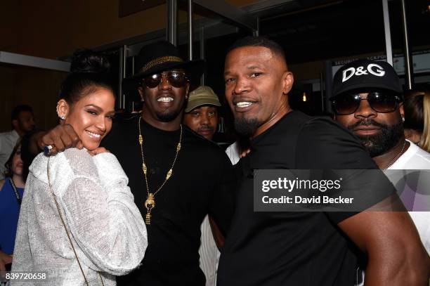 Dancer Cassie, recording artist Sean "Puffy" Combs and actor Jamie Foxx arrive on T-Mobile's magenta carpet duirng the Showtime, WME IME and...