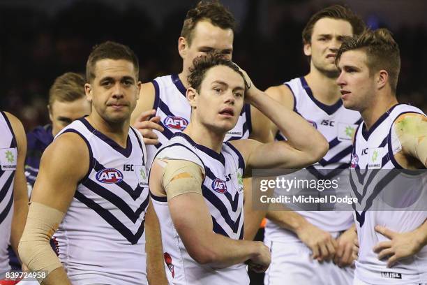 Lachie Weller of the Dockers and teammates after their defeat during the round 23 AFL match between the Essendon Bombers and the Fremantle Dockers at...