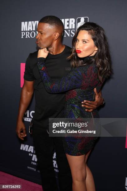 Actors Jamie Foxx and Olivia Munn arrive on T-Mobile's magenta carpet duirng the Showtime, WME IME and Mayweather Promotions VIP Pre-Fight Party for...