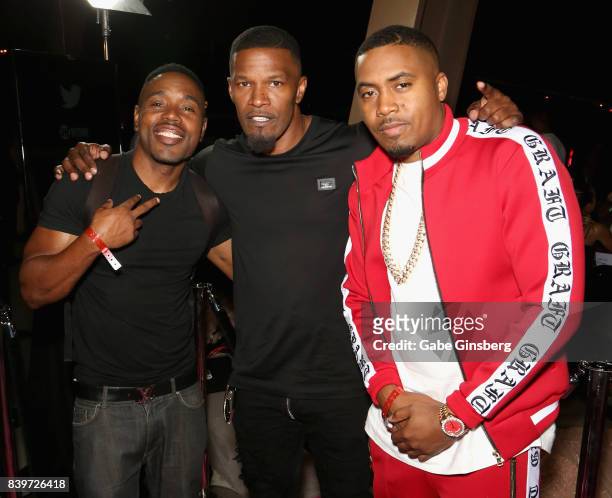 Actor Jamie Foxx and recording artist Nas arrive on T-Mobile's magenta carpet duirng the Showtime, WME IME and Mayweather Promotions VIP Pre-Fight...