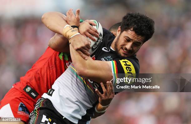 Corey Harawira Naera of the Panthers is tackled during the round 25 NRL match between the Penrith Panthers and the St George Illawarra Dragons at...