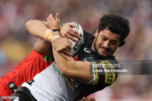 Corey Harawira Naera of the Panthers is tackled during the round 25 NRL match between the Penrith Panthers and the St George Illawarra Dragons at...
