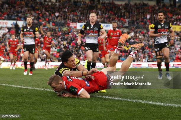 Matthew Dufty of the Dragons scores a try during the round 25 NRL match between the Penrith Panthers and the St George Illawarra Dragons at Pepper...