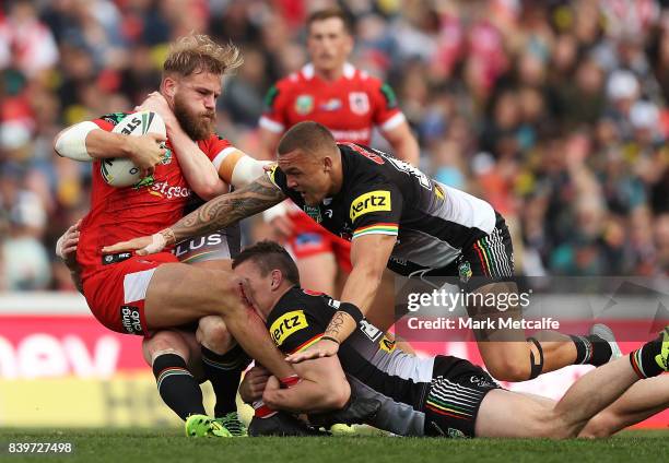 Jack de Belin of the Dragons is tackled during the round 25 NRL match between the Penrith Panthers and the St George Illawarra Dragons at Pepper...