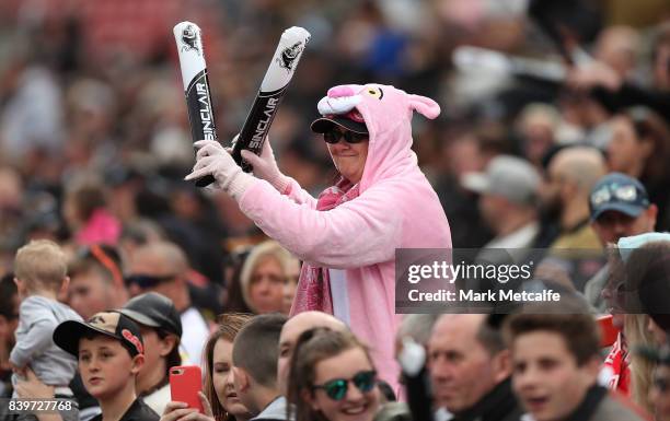 Panthers fan wearing fancy dress dances during the round 25 NRL match between the Penrith Panthers and the St George Illawarra Dragons at Pepper...