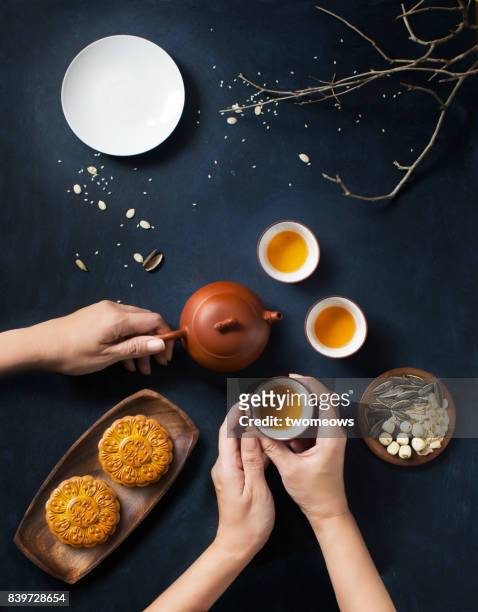 flat lay mid autumn festival tea time, food and drink table top shot. - mooncake stock pictures, royalty-free photos & images