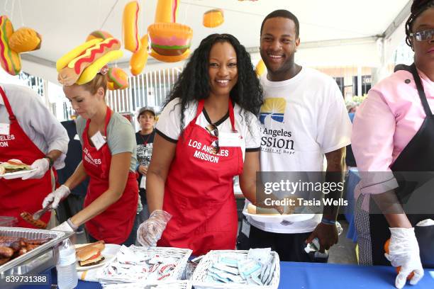 Garcelle Beauvais and son Oliver Saunders at the Los Angeles Mission's End of Summer Arts and Education Fair at Los Angeles Mission on August 26,...