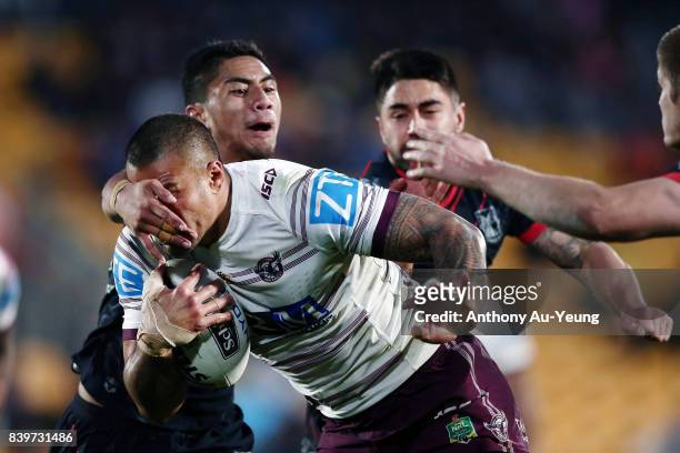Frank Winterstein of the Sea Eagles is tackled by Mafoa'aeata Hingano of the Warriors during the round 25 NRL match between the New Zealand Warriors...