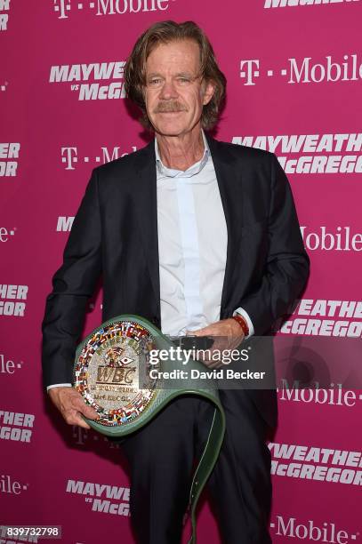 Actor William H. Macy poses with the WBC Money Belt on T-Mobile's magenta carpet duirng the Showtime, WME IME and Mayweather Promotions VIP Pre-Fight...