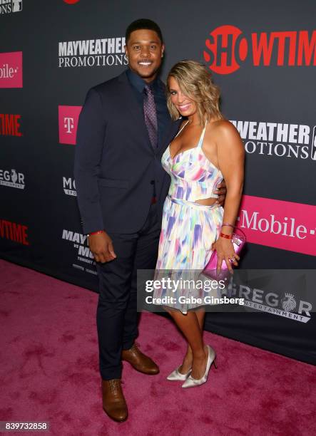 Actor Pooch Hall and his wife Linda Baptista Hall arrive on T-Mobile's magenta carpet duirng the Showtime, WME IME and Mayweather Promotions VIP...