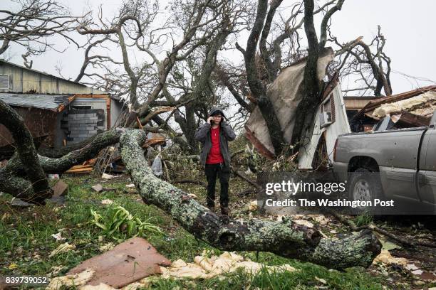 The Sea, TX People gather supplies out of destroyed homes to take back to a shelter near City-By-The Sea, TX as Hurricane Harvey hits the Texas coast...