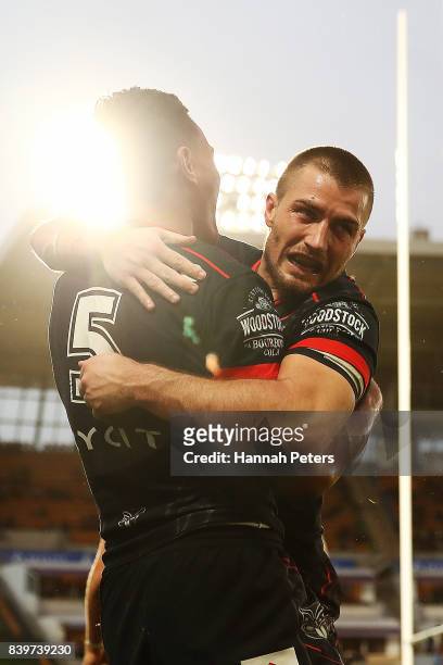 Ken Maumalo celebrates with Kieran Foran of the Warriors after scoring a try during the round 25 NRL match between the New Zealand Warriors and the...