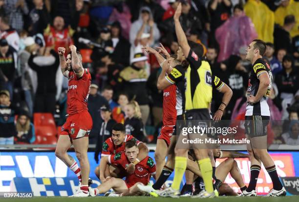 Dragons players celebrate victory in the round 25 NRL match between the Penrith Panthers and the St George Illawarra Dragons at Pepper Stadium on...