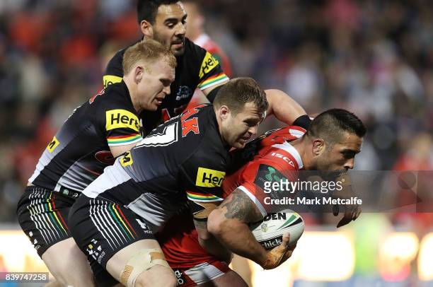Paul Vaughan of the Dragons is tackled during the round 25 NRL match between the Penrith Panthers and the St George Illawarra Dragons at Pepper...