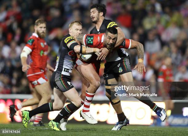 Paul Vaughan of the Dragons is tackled during the round 25 NRL match between the Penrith Panthers and the St George Illawarra Dragons at Pepper...