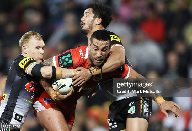 Paul Vaughan of the Dragons is tackled during the round 25 NRL match between the Penrith Panthers and the St George Illawarra Dragons at Pepper...