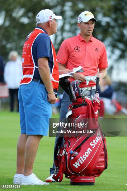 Marcel Siem of Germany looks on with his caddie during the final round of Made in Denmark at Himmerland Golf & Spa Resort on August 27, 2017 in...