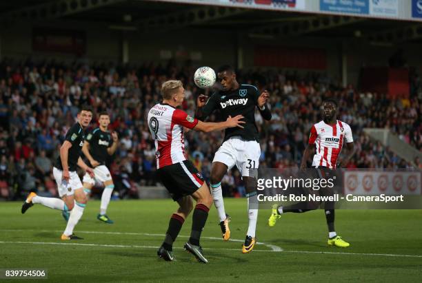 West Ham United's Edimilson Fernandes and Cheltenham Town's Danny Wright during the Carabao Cup Second Round match between Cheltenham Town and West...