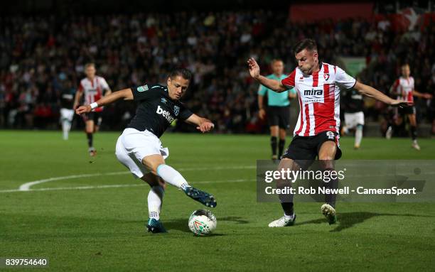 West Ham United's Javier Hernandez and Cheltenham Town's Kevin Dawson during the Carabao Cup Second Round match between Cheltenham Town and West Ham...