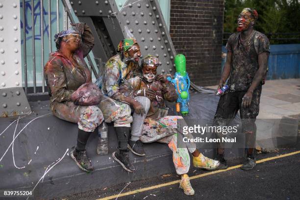 Paint-covered revellers take part in the traditional "J'ouvert" opening parade of the Notting Hill carnival on August 27, 2017 in London, England.