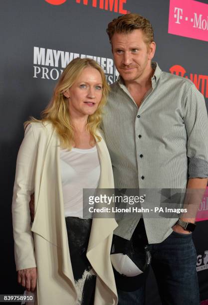 Paula Malcomson and Dash Mihok attend the Floyd Mayweather Jr v Conor McGregor fight at the T-Mobile Arena, Las Vegas.