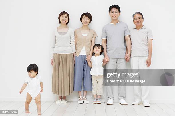 portrait of multi-generation family, baby girl walking away - japanese girls hot fotografías e imágenes de stock