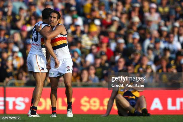 Eddie Betts of the Crows celebrates a goal with Charlie Cameron during the round 23 AFL match between the West Coast Eagles and the Adelaide Crows at...