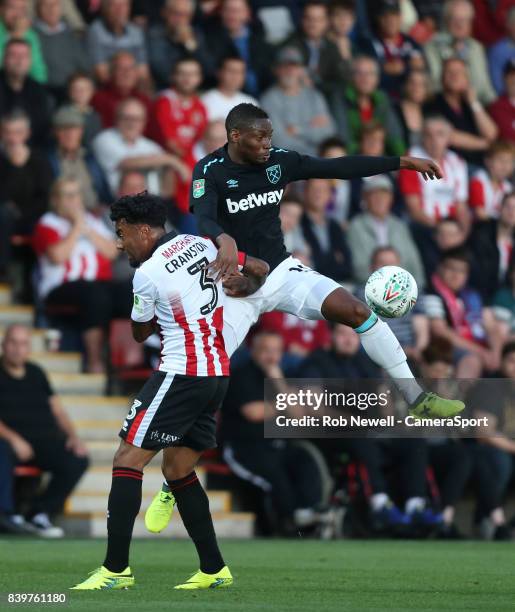 West Ham United's Diafra Sakho and Cheltenham Town's Jordan Cranston during the Carabao Cup Second Round match between Cheltenham Town and West Ham...