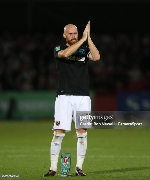 West Ham United's James Collins applauds the West Ham fans at the end of the game during the Carabao Cup Second Round match between Cheltenham Town...