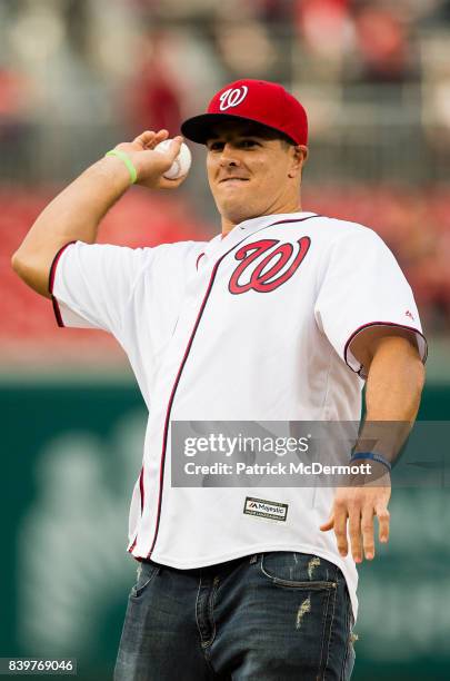 Washington Redskins outside linebacker Ryan Kerrigan throws a ceremonial first pitch before a game between the New York Mets and Washington Nationals...