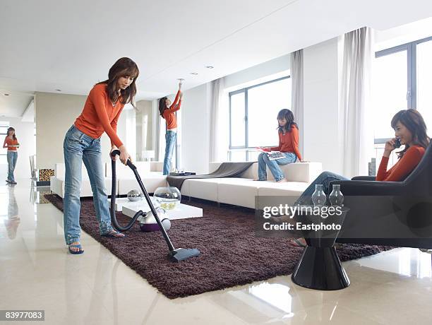 woman multi-tasking. - people cleaning at home stock-fotos und bilder