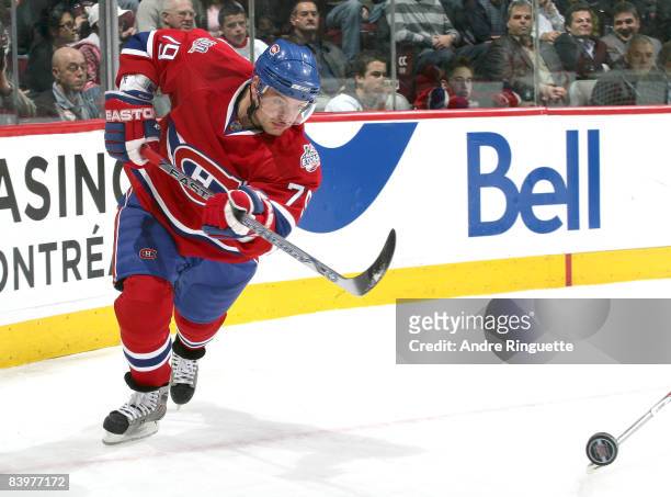 Andrei Markov of the Montreal Canadiens fires the puck off the glass against the Calgary Flames at the Bell Centre on December 9, 2008 in Montreal,...
