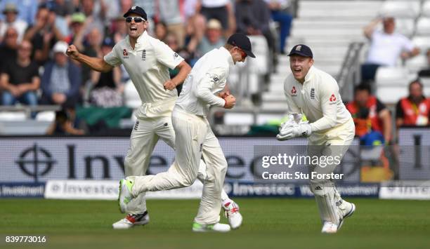 England captain Joe Root celebrates with Alastair Cook and wicketkeeper Jonny Bairstow after catching Shane Dowrich during day three of the 2nd...