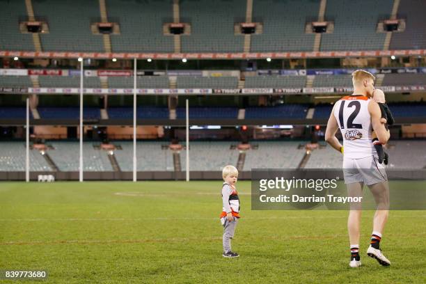 Nick Riewoldt of the Saints takes a last walk on the M.C.G. With his sons James and William after the round 23 AFL match between the Richmond Tigers...