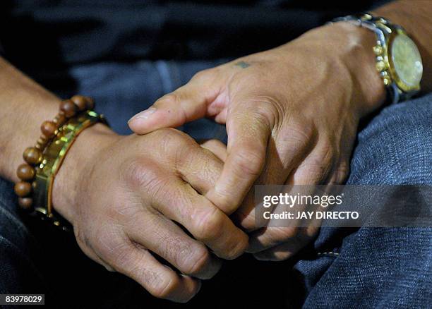 Filipino boxing icon Manny Pacquiao with still swollen fists during a courtesy call on President Gloria Arroyo at Malacanang palace in Manila on...