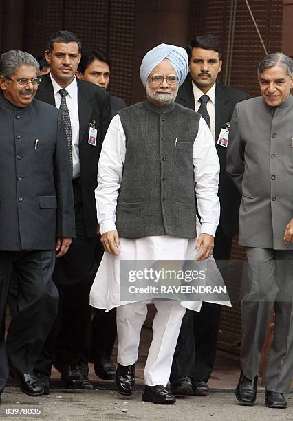 Indian Prime Minister Manmohan Singh arrives at Parliament house in New Delhi on December 10, 2008 to attend the opening of the third leg of the...