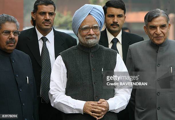 Indian Prime Minister Manmohan Singh arrives at Parliament house in New Delhi on December 10, 2008 to attend the opening of the third leg of the...
