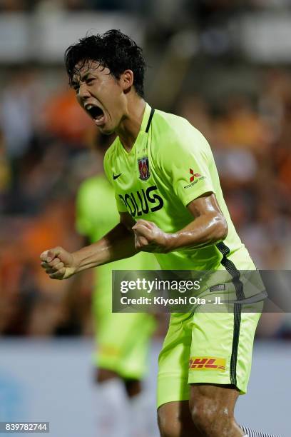 Wataru Endo of Urawa Red Diamonds celebrates scoring his side's first goal during the J.League J1 match between Shimizu S-Pulse and Urawa Red...