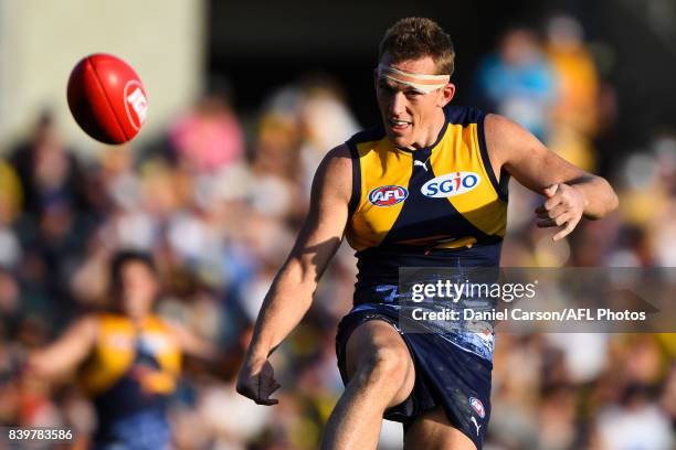 Drew Petrie of the Eagles kicks the ball during the 2017 AFL round 23 match between the West Coast Eagles and the Adelaide Crows at Domain Stadium on...