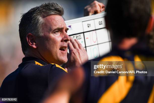 Adam Simpson, coach of the Eagles addresses the team at quarter time during the 2017 AFL round 23 match between the West Coast Eagles and the...