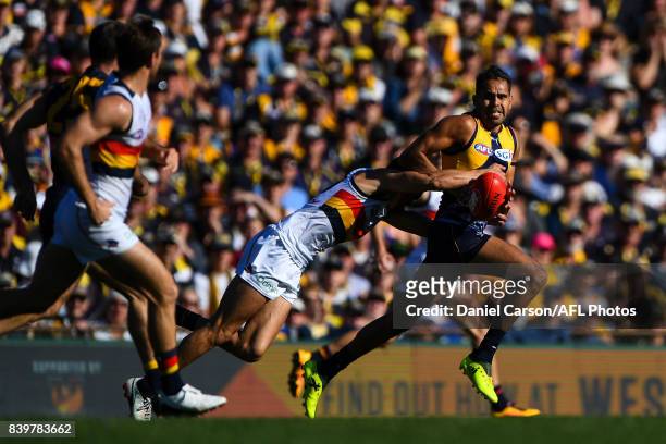 Lewis Jetta of the Eagles is chased down by Wayne Milera of the Crows during the 2017 AFL round 23 match between the West Coast Eagles and the...