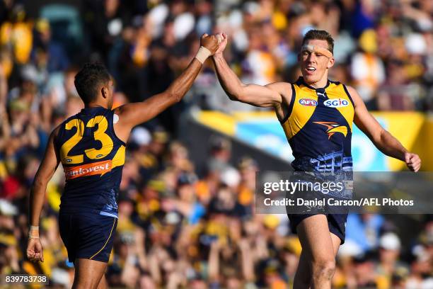 Lewis Jetta and Drew Petrie of the Eagles celebrates a goal during the 2017 AFL round 23 match between the West Coast Eagles and the Adelaide Crows...